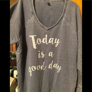 Light blue/gray sweatshirt.